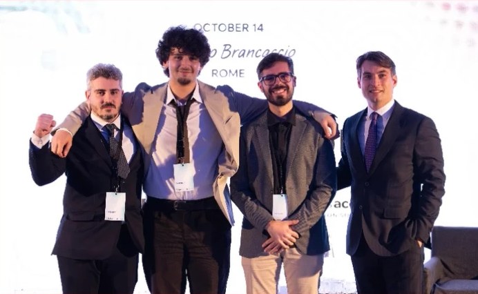 Group photo on stage at the Genesis Accel Innovation Summit, Palazzo Brancaccio, Rome.